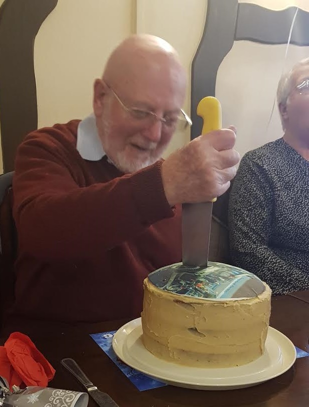 George Ralph Cutting his 80th Birthday Cake